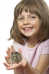 Wall Mural - little girl holding hamster - white background