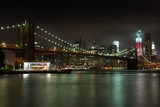 Fototapeta  - Manhattan skyline by night from Brooklyn bridge park