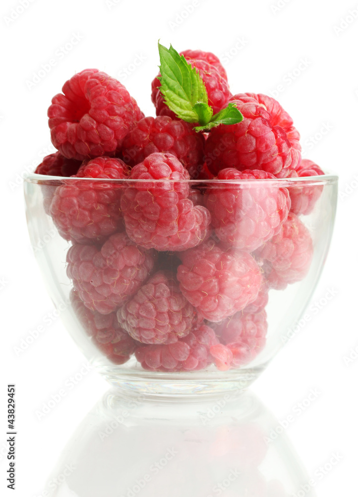 ripe raspberries with mint in glass bowl isolated on white