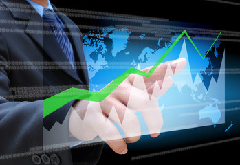 businessman hand pushing a business graph