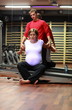 © endostock - Physical therapist stretching ,pregnant woman's arms in gym