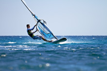 Side View Of Young Windsurfer