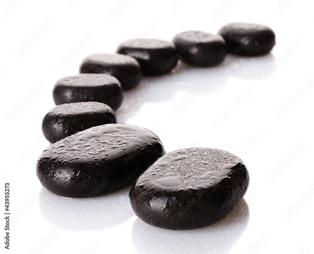 Spa stones with drops isolated on white