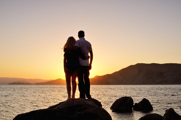 Young couple watching the sun