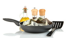 Banknotes In A Frying Pan With Cooking Spatula Isolated On