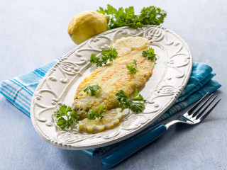 breaded sole fish with parsley and lemon