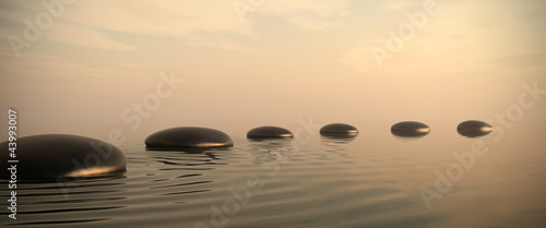 Naklejka ścienna Zen path of stones on sunrise in widescreen