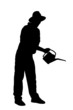 Silhouette of a person with holding a watering can