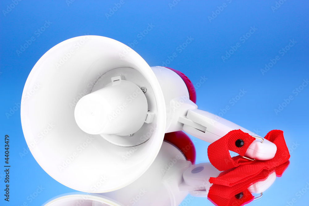 red and white megaphone on blue background