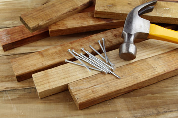 Wall Mural - Hammer and nails on wood