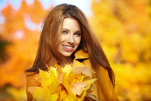 Beautiful Elegant Woman Standing In A Park In Autumn