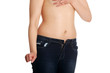 © Piotr Marcinski - Naked belly of young woman wearing only jeans.