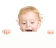© Andrey Kuzmin - Curly child holding blank advertising banner