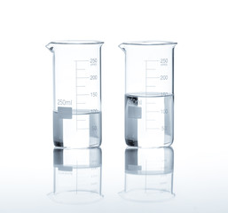 laboratory flasks with a clear liquid, isolated