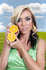 Wall Mural - Woman Holding Orange Slices