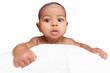 Baby peeping over the pillow in a white background