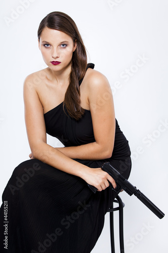 Weiblicher Killer Im Abendkleid Mit Pistole Und Schalldampfer Buy This Stock Photo And Explore Similar Images At Adobe Stock Adobe Stock