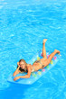 © Netfalls - Woman Relaxing in a pool