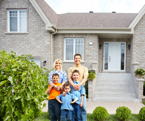 Poster - Happy family near new house.