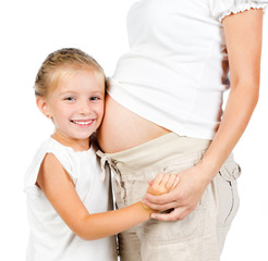 little girl with stomach of pregnant mother