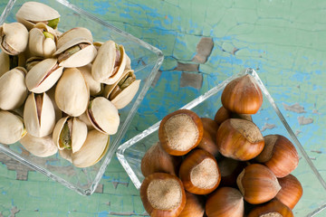 Wall Mural - Pistachios and hazelnuts on the vintage wooden surface.