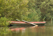 Red Rowing Boat On Lake