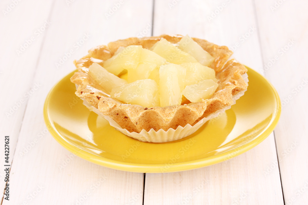 sweet cake with fruits on wooden background