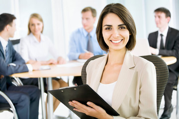 Wall Mural - Happy business woman with colleagues