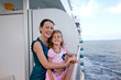 © Pavel Losevsky - smiling mother and daughter traveling on big cruise ship