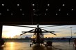 silhouette of helicopter in the hangar