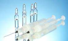 Syringes Monovet And Ampoules On Blue Background