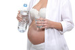 Pregnant woman with a bottle of water
