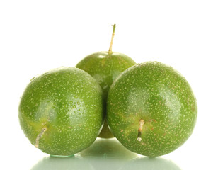 three green passion fruit isolated on white