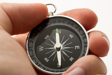 Wall Mural - Hand holding silver black compass