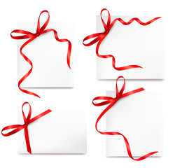 collection of cards with red gift bows with ribbons