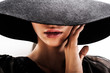 © queen21 - girl in black hat touching face and lips