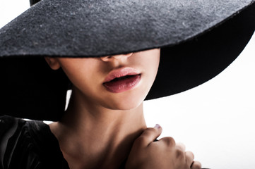 Sticker - girl in black hat touching face and lips