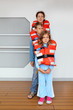 © Pavel Losevsky - Mother, son and daughter test their orange life jackets at deck