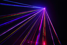 Lot Of Beautiful Multi-colored Laser Beams In Dark At Disco.