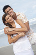 © Darren Baker - Man and Woman Couple Embracing On A Beach