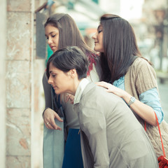 Canvas Print - Young Women in front of a Clothing Store