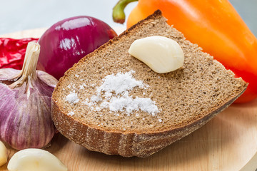 Canvas Print - Garlic with rye bread and salt