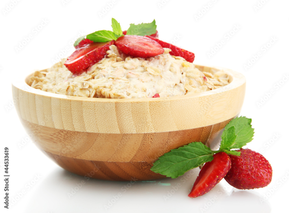 tasty oatmeal with strawberries, isolated on white