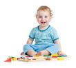 © Andrey Kuzmin - happy child playing educational toys isolated on white