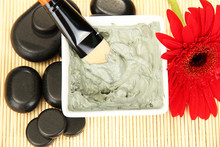 Cosmetic Clay For Spa Treatments On Straw Background Close-up