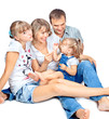 © irinapiter - positive family of four sitting and talking