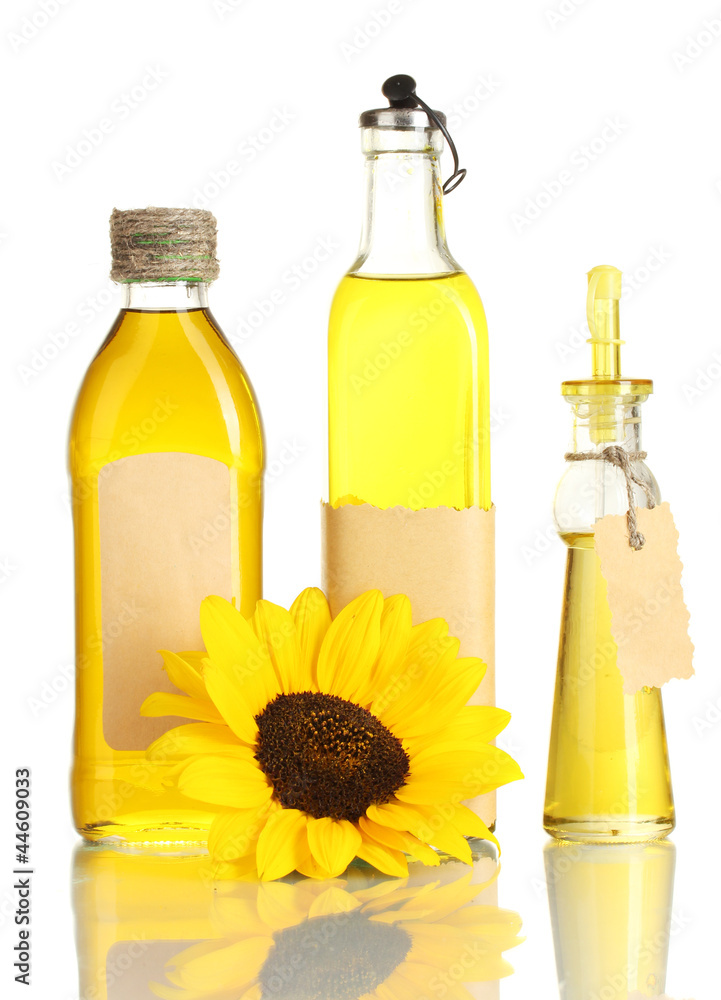 oil in jars and sunflower, isolated on white