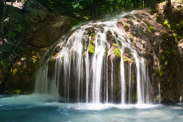 Wall Mural - Small waterfall in deep forest