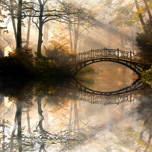 Naklejka na szybę Autumn - Old bridge in autumn misty park