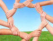 © koszivu - Ring of hands teamwork showing your product in nature
